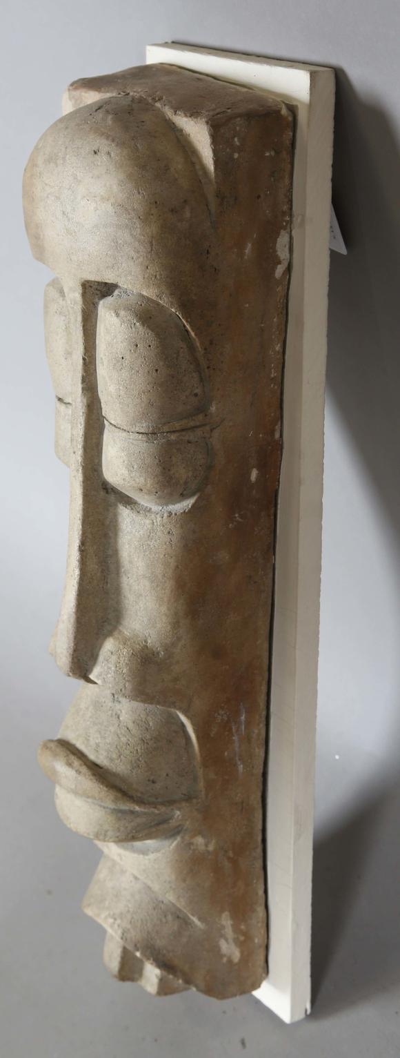 TooveysAttributed to Sidney A. Kumalo - a mid-20th century stoneware/composition wall mounted mask of stylized form, height 60cm, width 16cm, together with r
