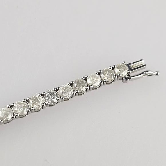 Auktionshaus BlankFeines 14K-Tennisarmband - Wei?gold 585/000 (14 K.), ausgefasst mit