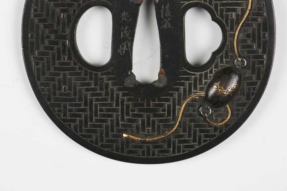 TooveysA very fine Japanese oval shakudo-inlaid bronze tsuba, Edo p