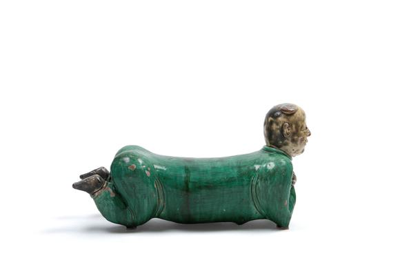 Marcopolo AuctionsPOLYCHROME SANCAI CERAMIC SCULPTURE DEPICTING A RECLINING CHILD, China, late 19th / early 20th century