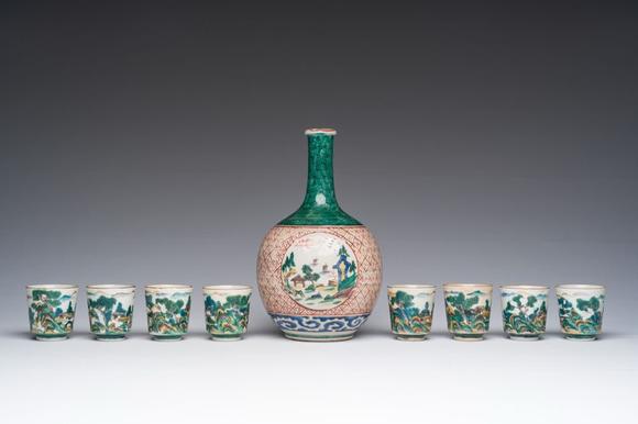 Coronari Auctions BVA Japanese Kutani 'tokuri' or sake bottle and eight cups with landscape design, Meiji, 19th C.