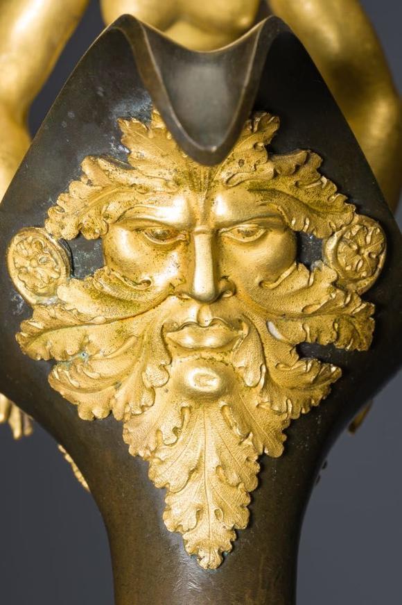 Coronari Auctions BVAn impressive pair of French Empire gilt and patinated bronze ewers on marble bases, attributed to Claude Galle, ca. 1800-1810