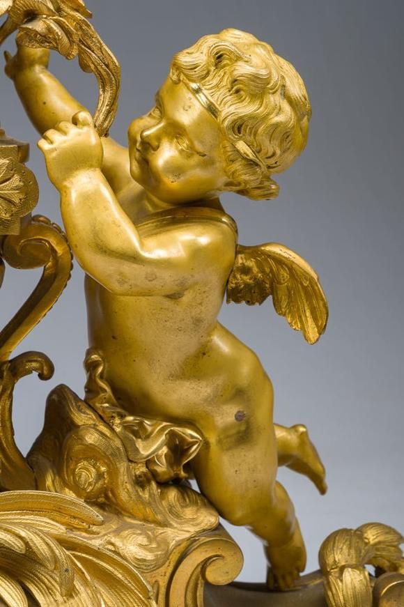 Coronari Auctions BVA fine and exceptional French Napoleon III gilt bronze three-piece clock garniture with putti and floral design, 19th C.