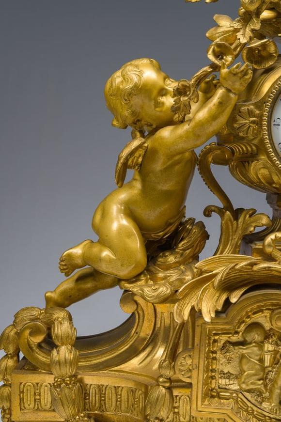 Coronari Auctions BVA fine and exceptional French Napoleon III gilt bronze three-piece clock garniture with putti and floral design, 19th C.