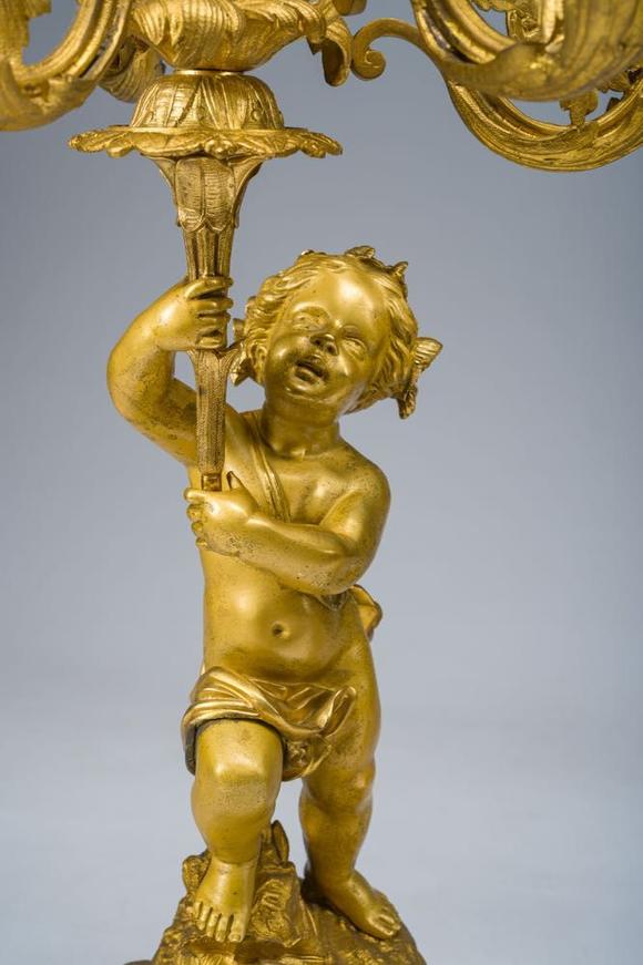 Coronari Auctions BVA fine and exceptional French Napoleon III gilt bronze three-piece clock garniture with putti and floral design, 19th C.