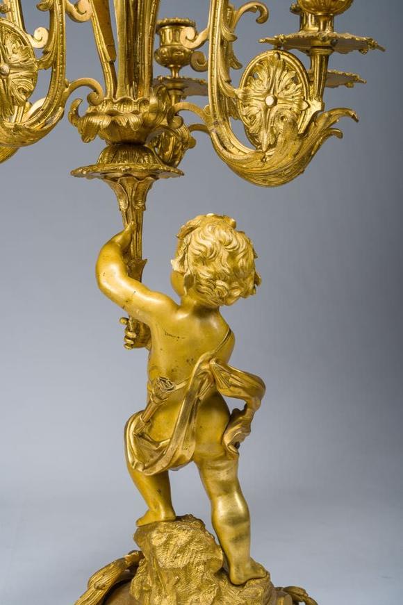 Coronari Auctions BVA fine and exceptional French Napoleon III gilt bronze three-piece clock garniture with putti and floral design, 19th C.