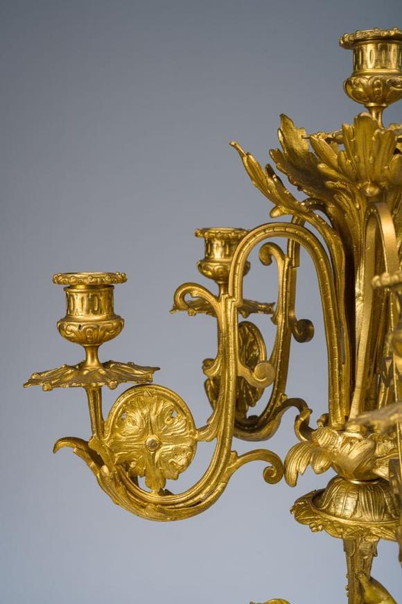 Coronari Auctions BVA fine and exceptional French Napoleon III gilt bronze three-piece clock garniture with putti and floral design, 19th C.