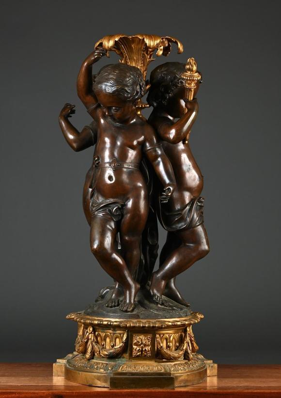 Loeckx AuctioneersA large and fine ornament in bronze \'three putti\',…