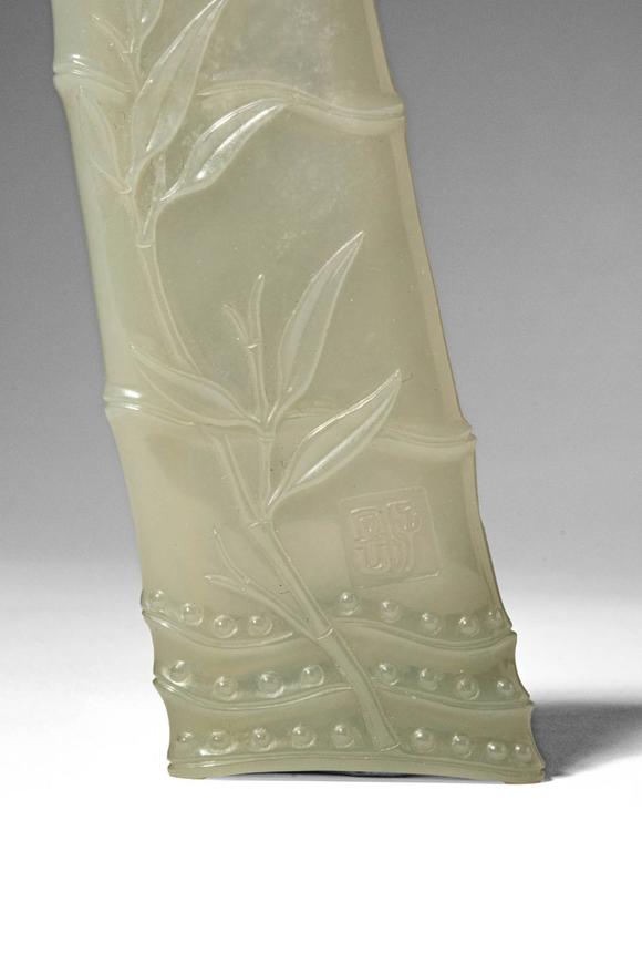 Apollo Art AuctionsQing Dynasty, Ca. AD 1644 - 1912. >
A carved celadon jade brush rest in the form of a naturalisti