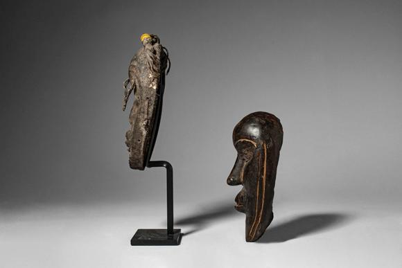 Apollo Art AuctionsCa. late 19th - early 20th century AD. >
A group comprising two carved wooden miniature masks of