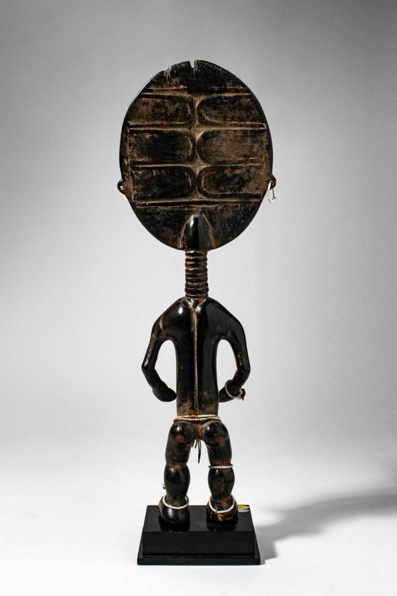 Apollo Art AuctionsCa. late 19th - early 20th century AD. >
A stylised female figure with a large disc-shaped head,