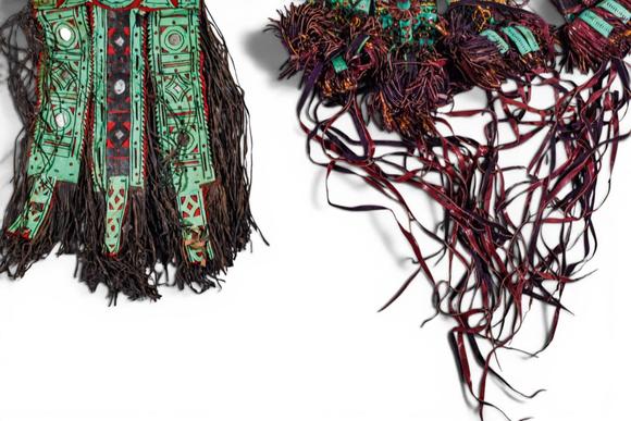 Apollo Art AuctionsCa. 20th century AD. >
A group of two textile costume elements, each richly embellished with poly