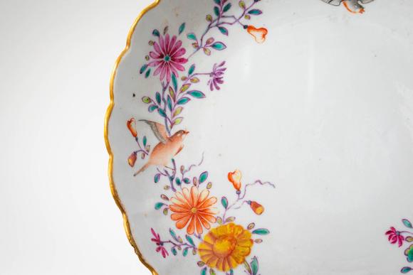 Apollo Art AuctionsMid Qing Dynasty, Ca. 18th century AD. >A famille rose porcelain dish of shallow, lobed form with