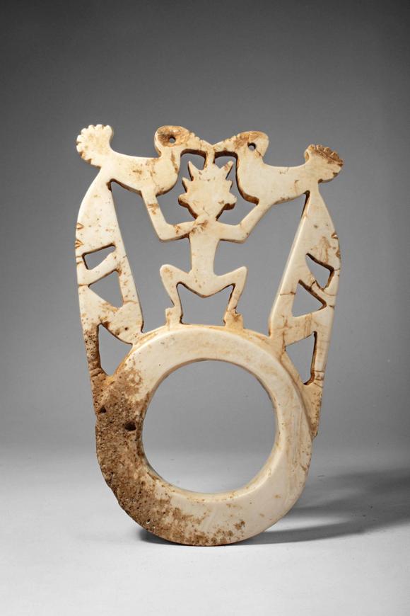 Apollo Art AuctionsCa. early 20th century AD. >
A pale stone openwork barava pendant features a complex figural comp