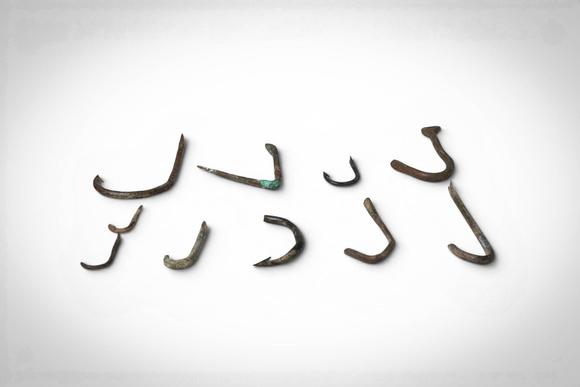 Apollo Art AuctionsCa. 1st - 4th century AD. >
A group comprising ten bronze fish hooks of varying size and form, in