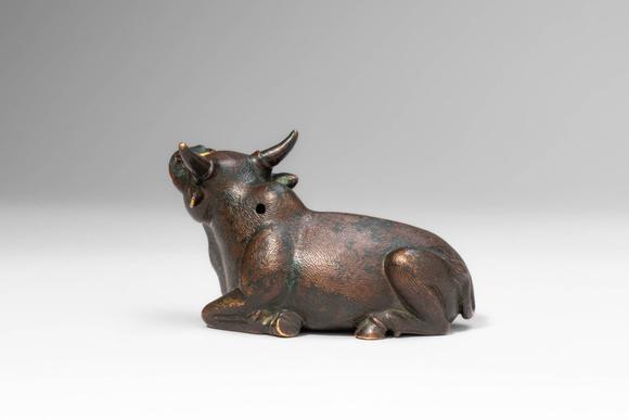 Apollo Art AuctionsMing Dynasty, Ca. AD 1368 - 1644, or earlier. >
A cast bronze figure of a recumbent bull, depicte