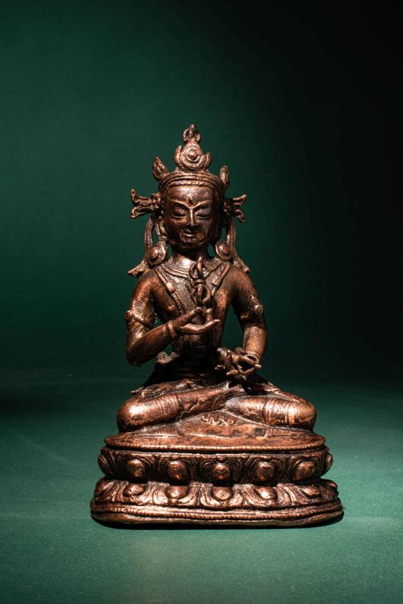 Apollo Art AuctionsCa. 14th century AD. >
A beautiful cast gilt copper alloy figure of Vajrasattva, seated in vajrap