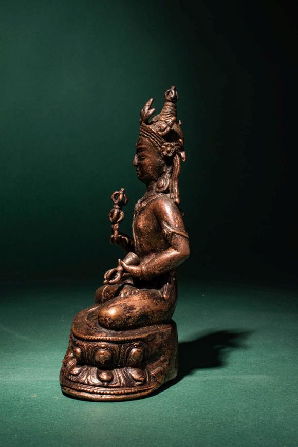 Apollo Art AuctionsCa. 14th century AD. >
A beautiful cast gilt copper alloy figure of Vajrasattva, seated in vajrap