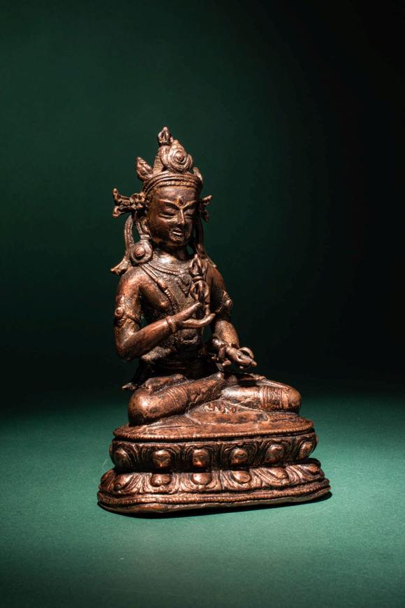 Apollo Art AuctionsCa. 14th century AD. >
A beautiful cast gilt copper alloy figure of Vajrasattva, seated in vajrap