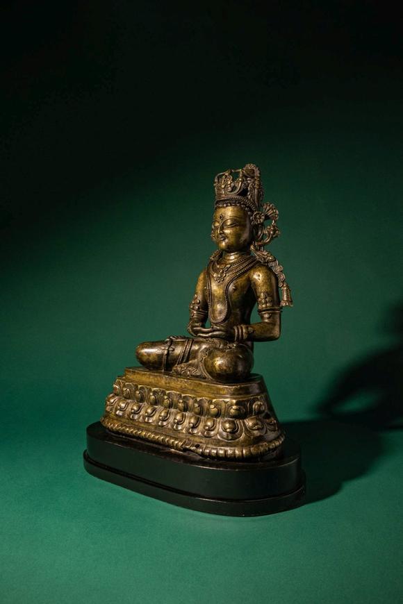 Apollo Art AuctionsCa. 14th century AD. >
A finely cast copper alloy figure depicting Kunzang Akor, seated in serene