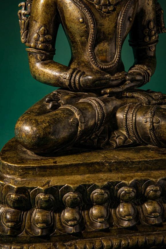 Apollo Art AuctionsCa. 14th century AD. >
A finely cast copper alloy figure depicting Kunzang Akor, seated in serene