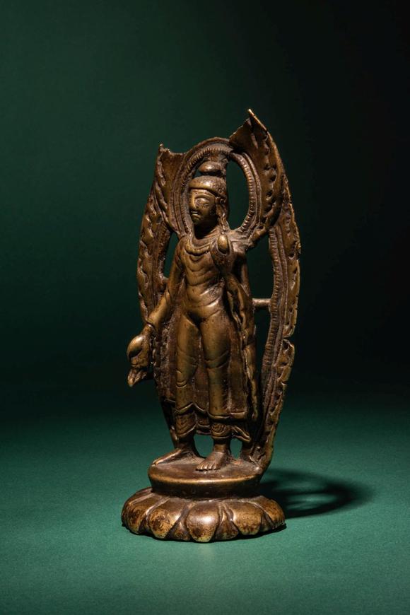 Apollo Art AuctionsCa. 10th - 11th century AD. >
A finely cast bronze figure of Buddha Shakyamuni standing in a fron
