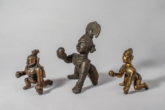 Apollo Art AuctionsCa. 12th-19th century AD. A group of three bronze figures of Krishna as the Butter Thief, each de