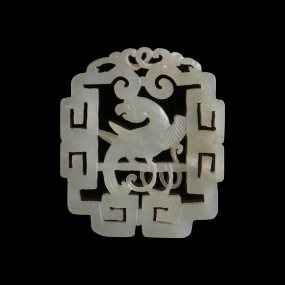 Oakridge Auction Gallery十八世紀(jì) 白玉鏤雕鸚鵡佩（附木座）  A Chinese reticulated white jade 'parrot' plaque