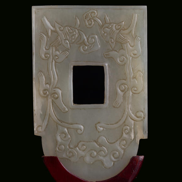 Oakridge Auction Gallery十九世紀 白玉雕螭龍紋斧形佩（附木架）  A Chinese carved white jade 'chilong' axe-form plaque