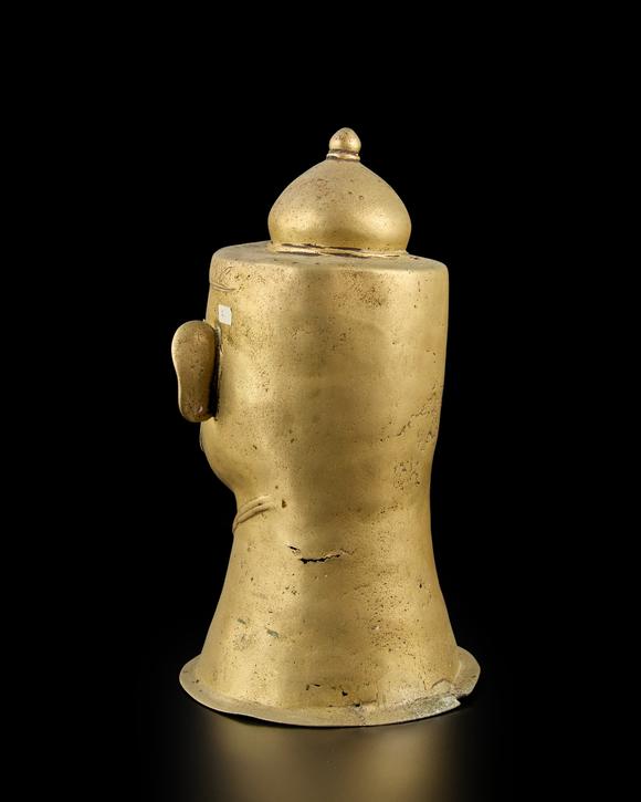 RoseberysA large brass Siva lingam cover
Western Deccan, 18th-19th century,

with almond eyes under curved eyebrows, with strong serpentine moustache, weari