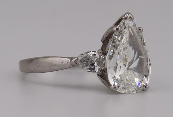 Clarke Auction GalleryJEWELRY. Platinum and 3.59ct Pear Diamond Ring.