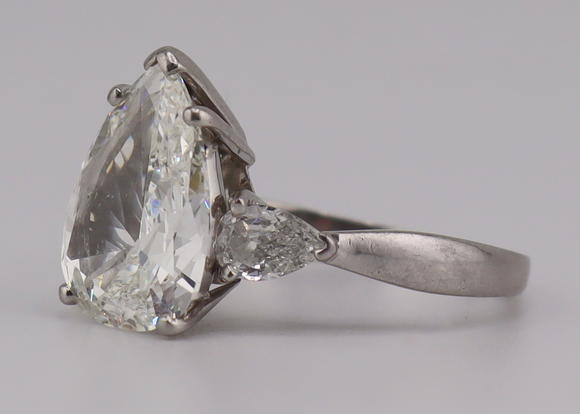 Clarke Auction GalleryJEWELRY. Platinum and 3.59ct Pear Diamond Ring.