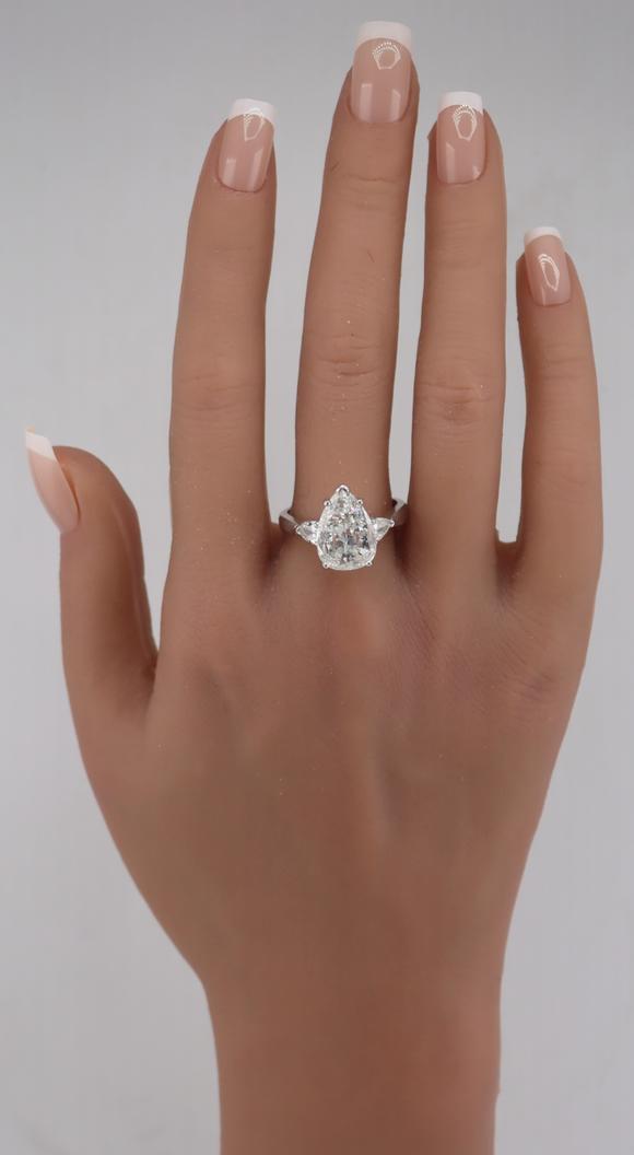Clarke Auction GalleryJEWELRY. Platinum and 3.59ct Pear Diamond Ring.