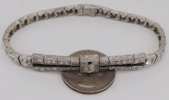 Clarke Auction GalleryJEWELRY. Art Deco Platinum, Diamond and Onyx