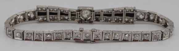 Clarke Auction GalleryJEWELRY. Art Deco Platinum, Diamond and Onyx