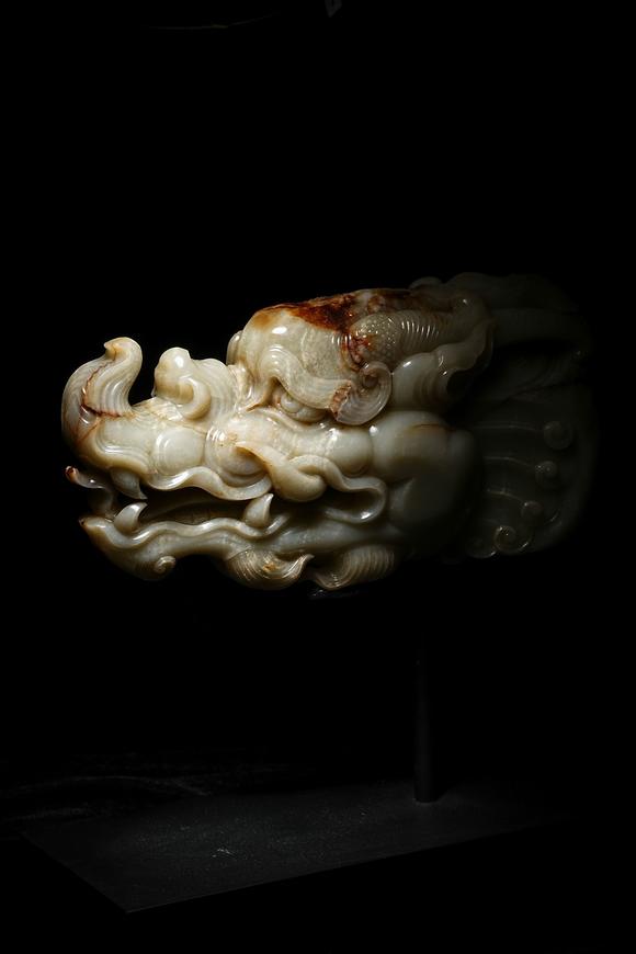 HUNG YUN ZHAI AUCTION HOUSE INCPre-Ming Dynasty or Earlier Hetian Jade Dragon-Head Ornament