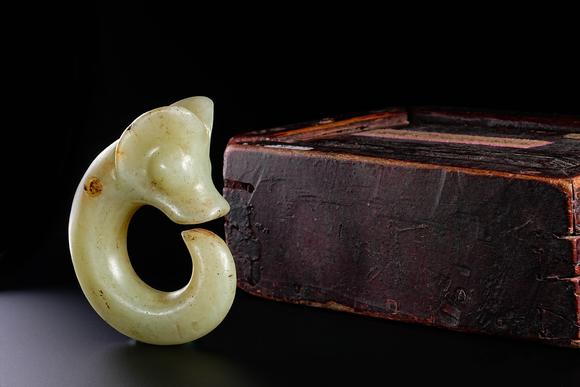 HUNG YUN ZHAI AUCTION HOUSE INCPre-Ming Dynasty Hetian Jade Dragon