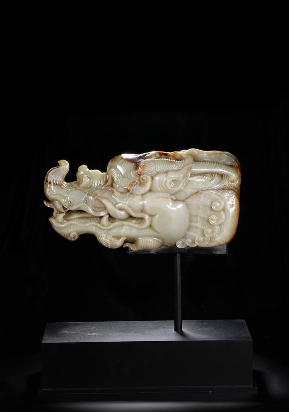 HUNG YUN ZHAI AUCTION HOUSE INCPre-Ming Dynasty or Earlier Hetian Jade Dragon-Head Ornament