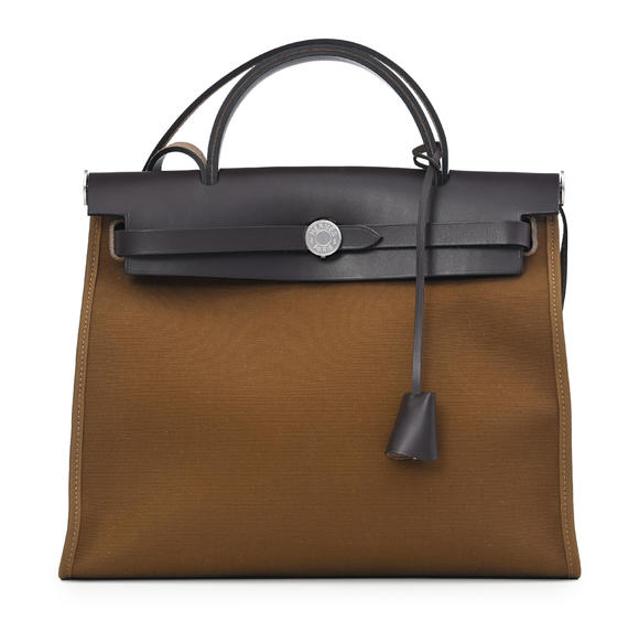 Piguet - H?tel des VentesHermès, sac Herbag Zip 31 en cuir Hunter marron et toile officier ébène, 2019, tirette, clochette, 2 clefs et cadenas