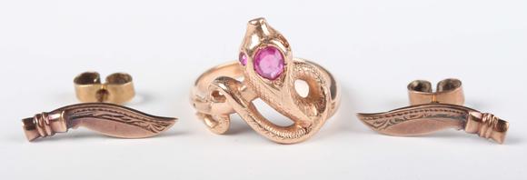 TooveysA gold, ruby and synthetic ruby ring, designed as a coiled snake, de