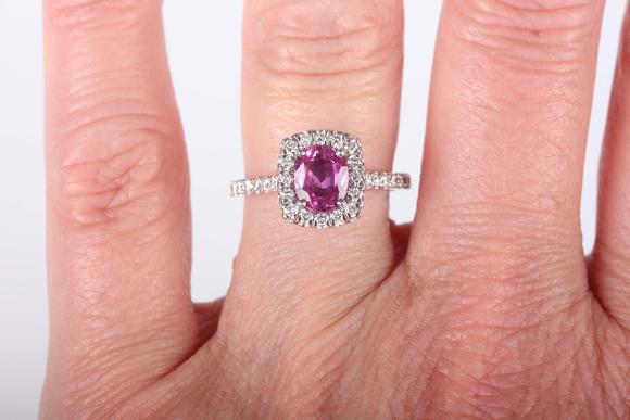 TooveysA platinum, pink sapphire and diamond cluster ring, claw set with th