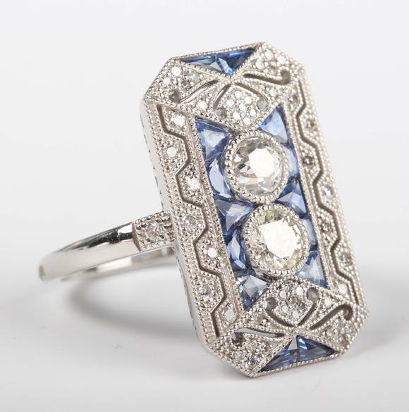 TooveysA platinum, sapphire and diamond panel ring in an Art Deco inspired