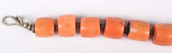 TooveysA single row necklace of graduated barrel form dyed coral beads, Nor