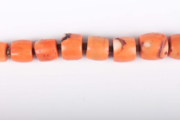 TooveysA single row necklace of graduated barrel form dyed coral beads, Nor