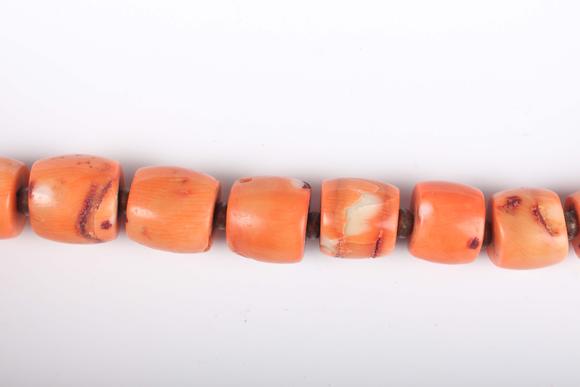 TooveysA single row necklace of graduated barrel form dyed coral beads, Nor