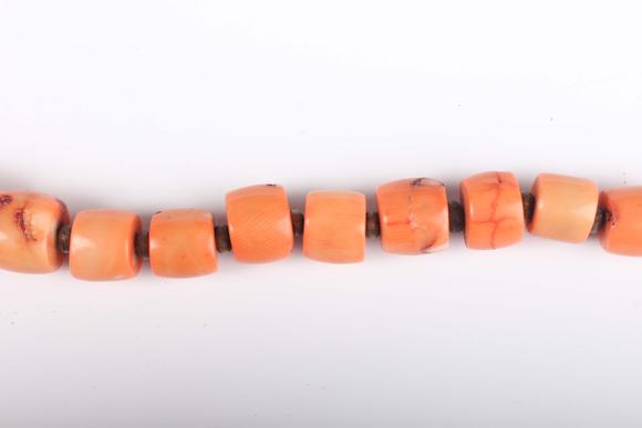 TooveysA single row necklace of graduated barrel form dyed coral beads, Nor