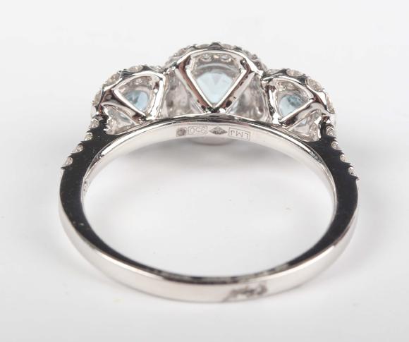 TooveysA platinum, aquamarine and diamond triple cluster ring, claw set wit