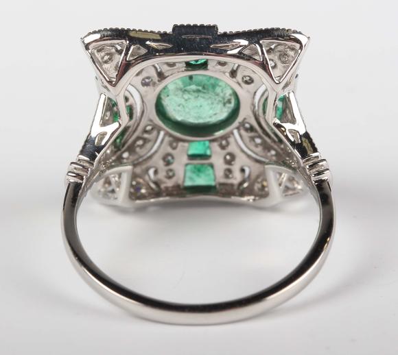 TooveysA platinum, emerald and diamond panel ring in an Art Deco inspired d