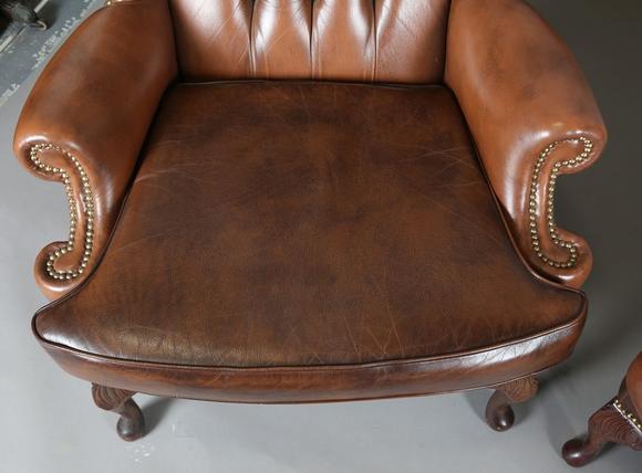 TooveysA pair of late 20th century George III style wing back armchairs, up