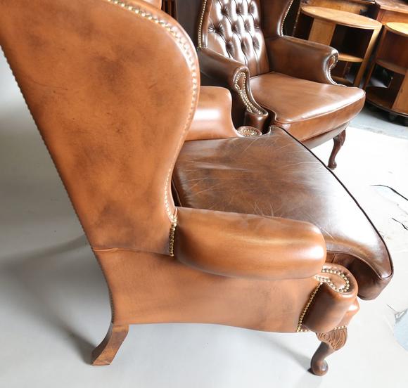 TooveysA pair of late 20th century George III style wing back armchairs, up